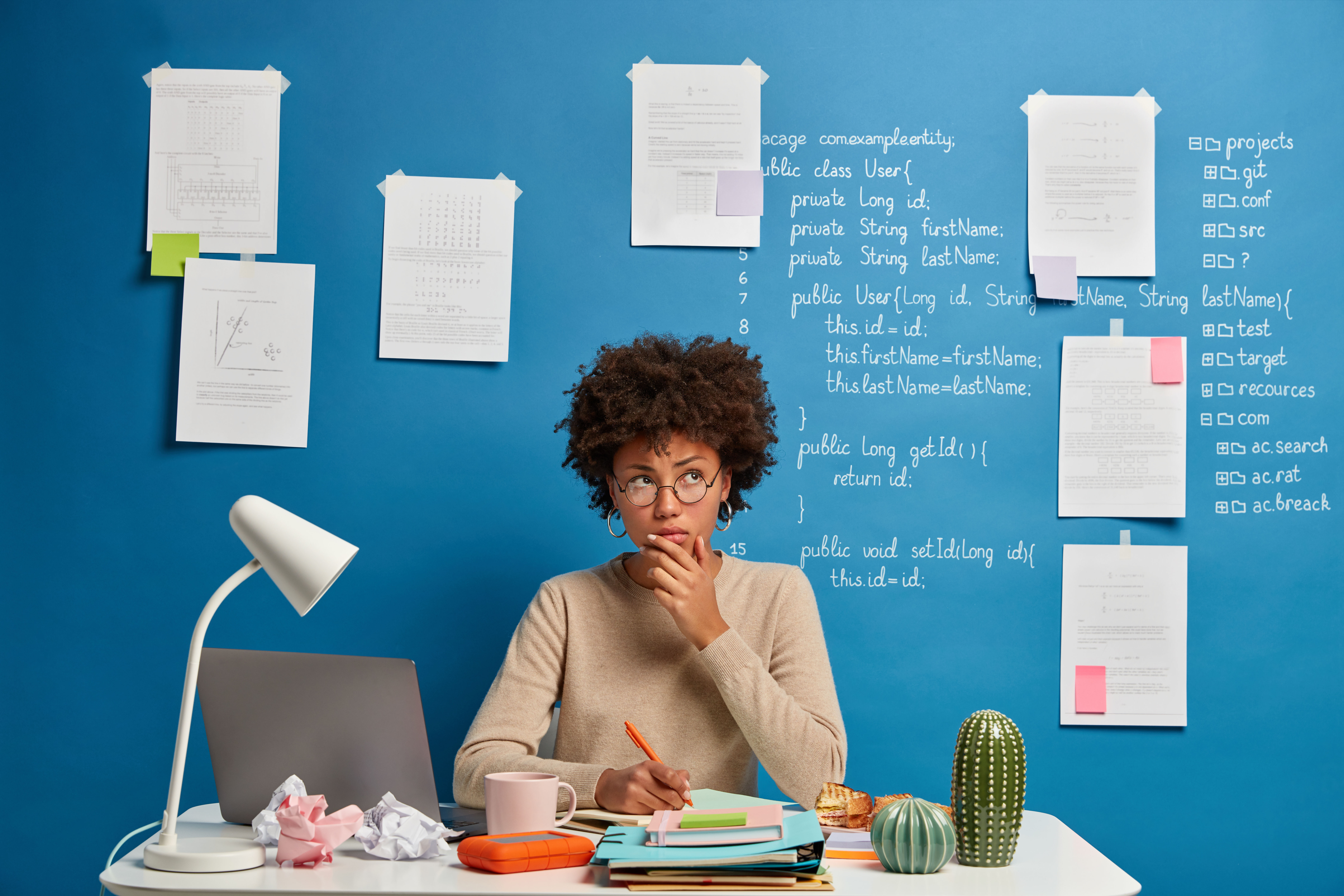 thoughtful attractive woman spectacles writes diary list goals makes notes personal organizer